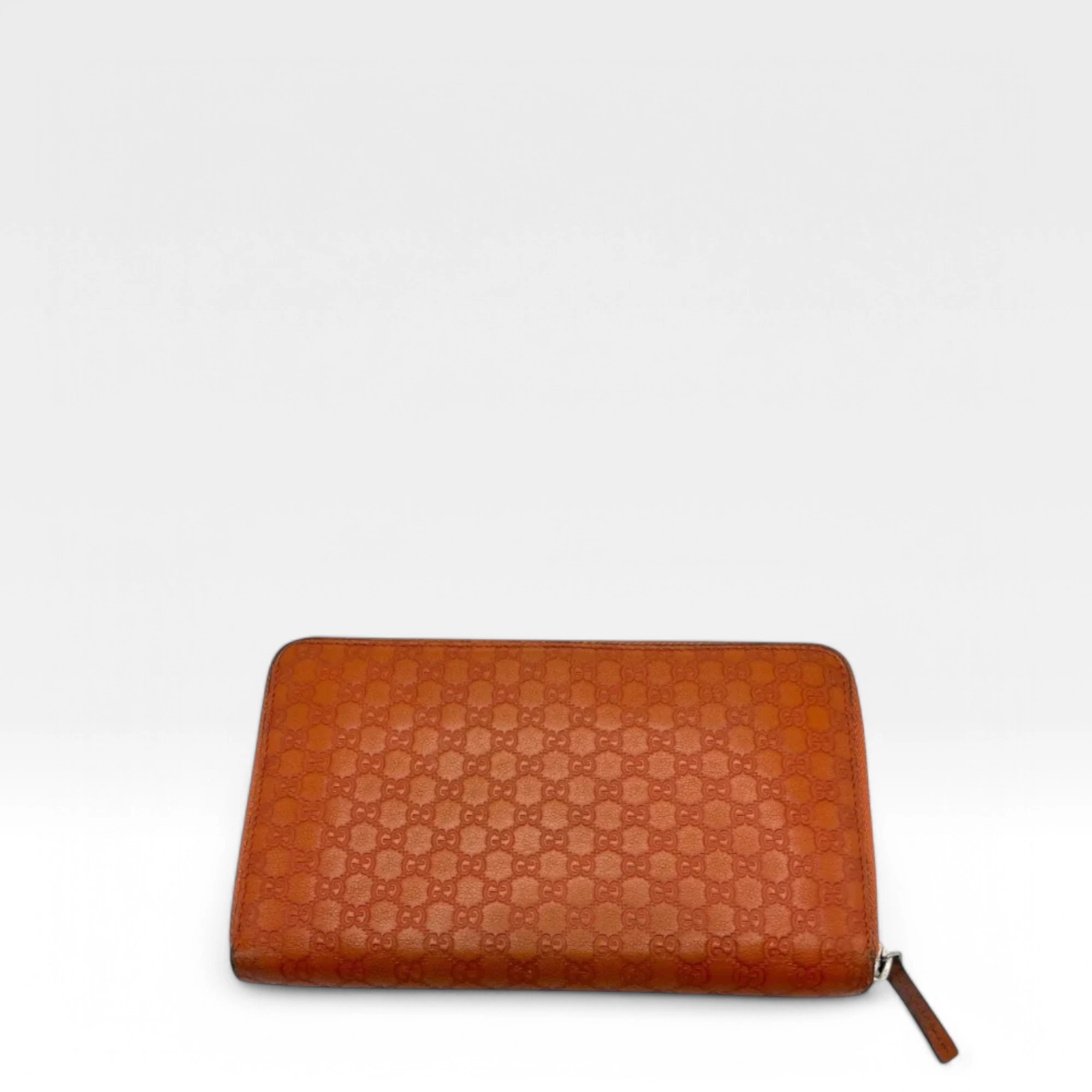 Gucci wallet made of orange monogram leather