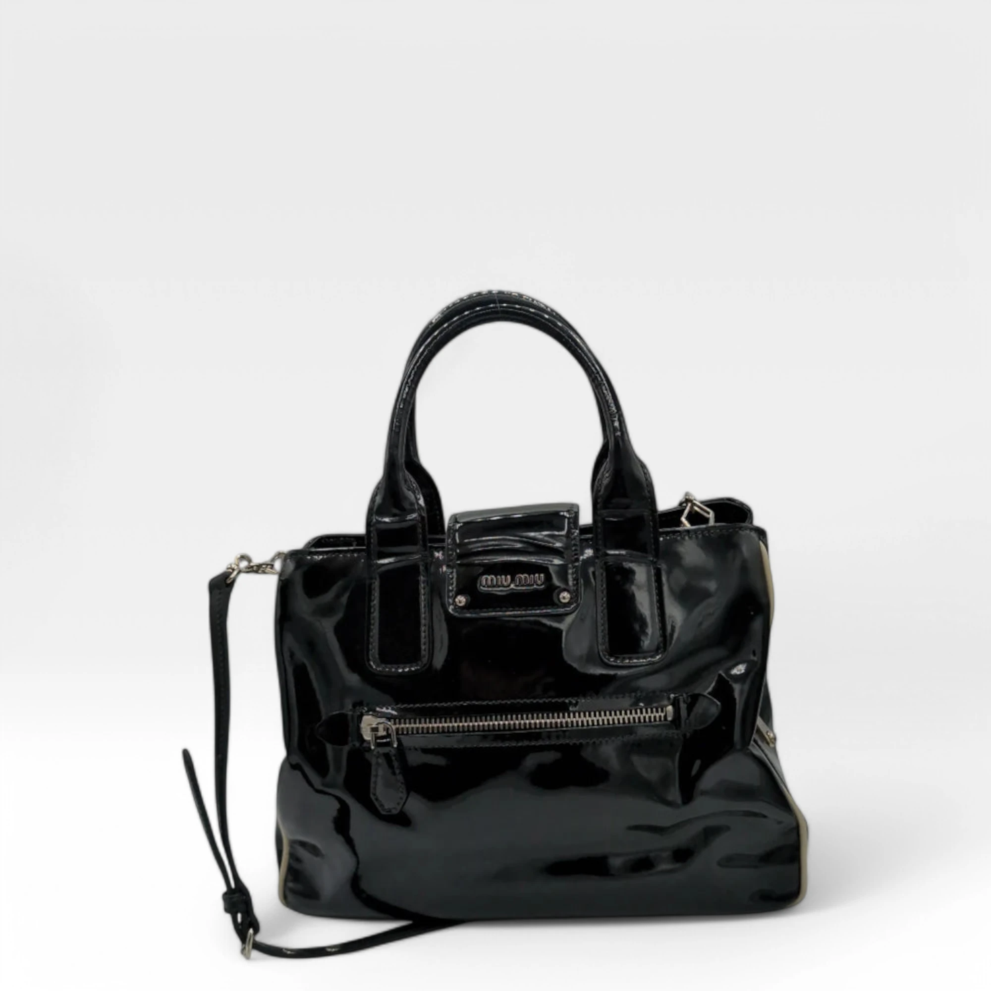 Miu Miu handbag with shoulder strap in black patent leather