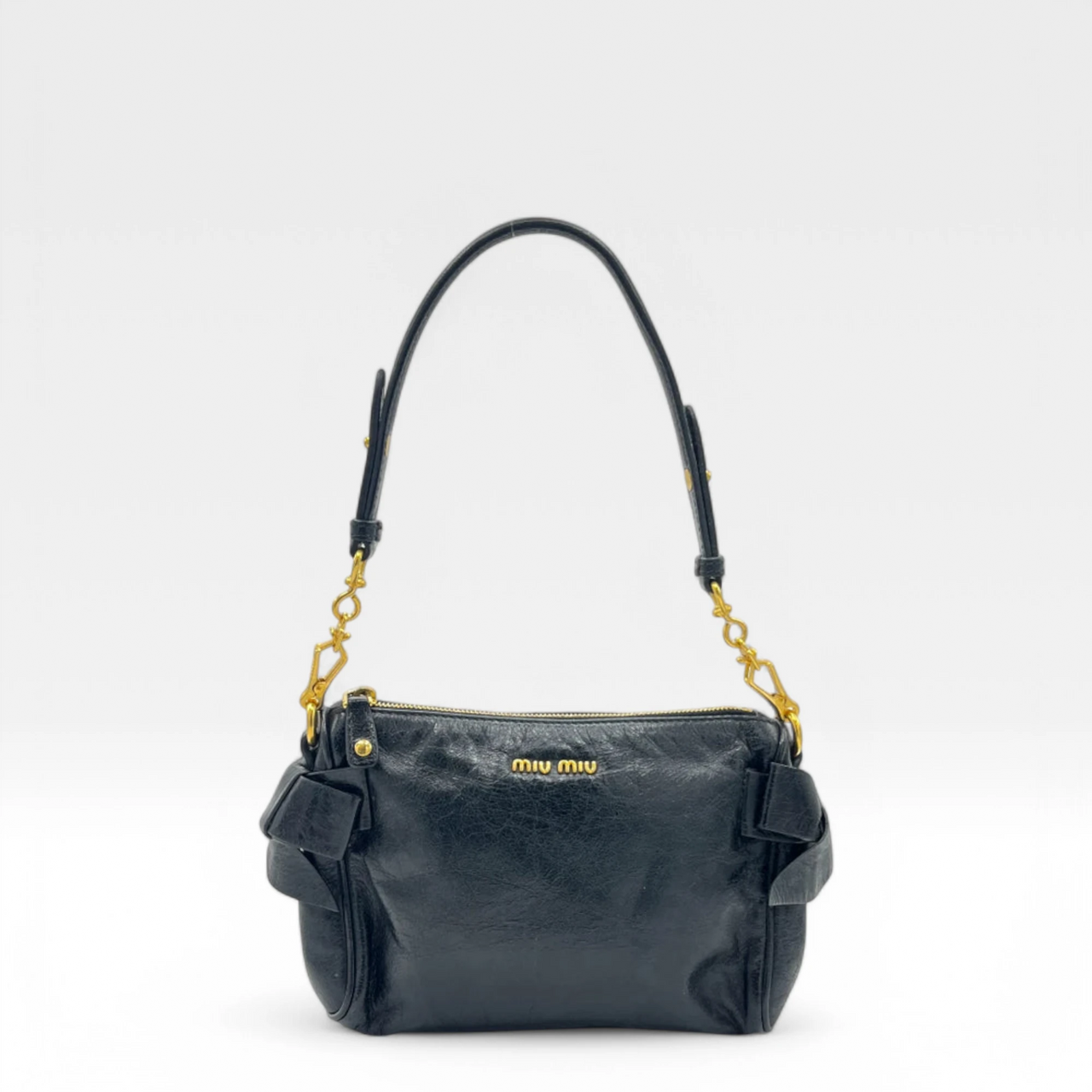 Miu Miu Pochette with bows in black leather