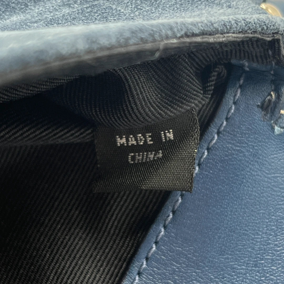Coach Clutch aus Wildleder blau