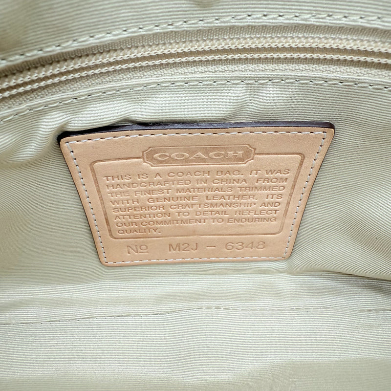 Coach Pochette Signature Soho