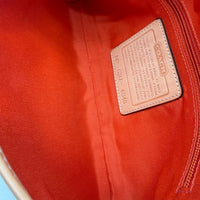 Coach Pochette Signature Soho