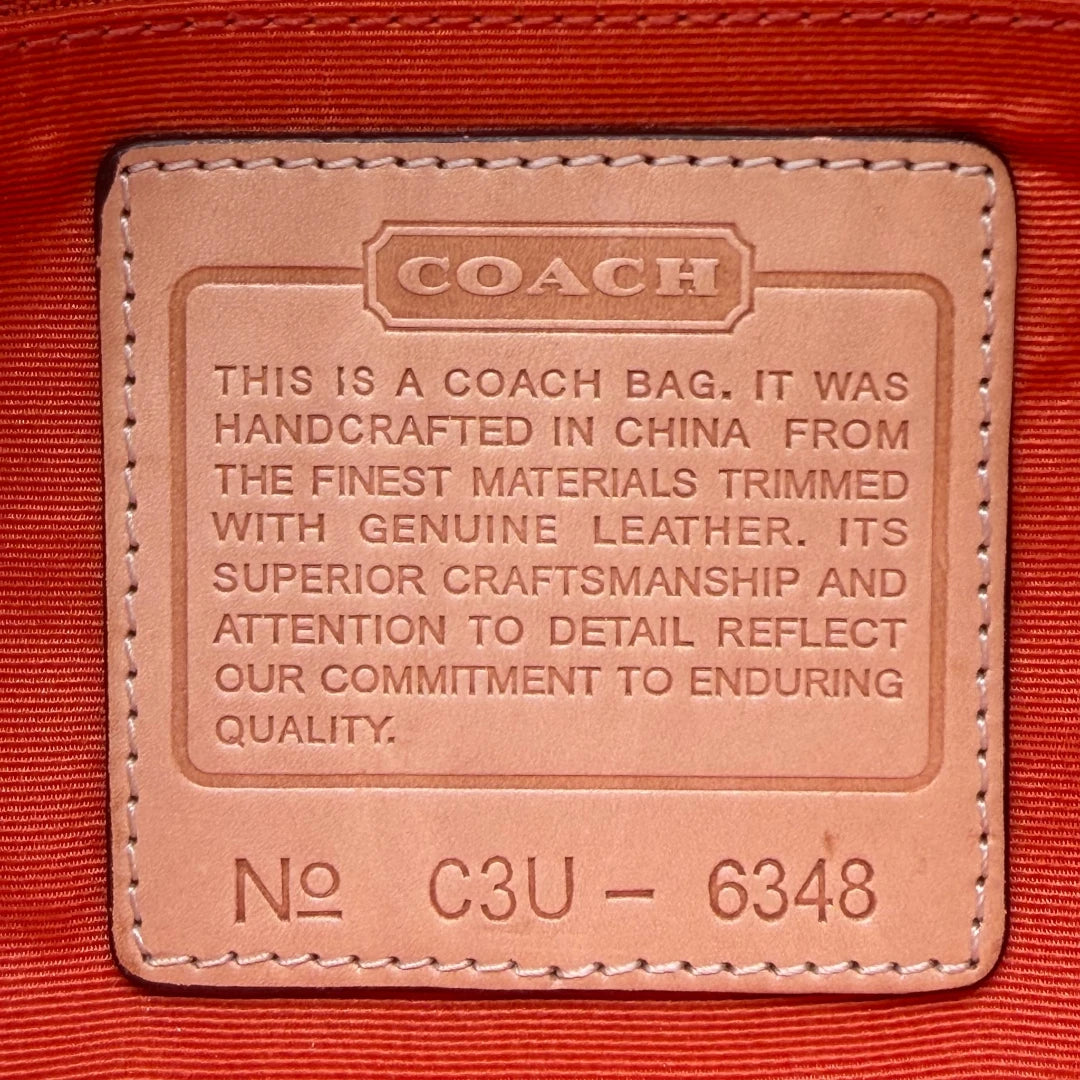 Coach Pochette Signature Soho