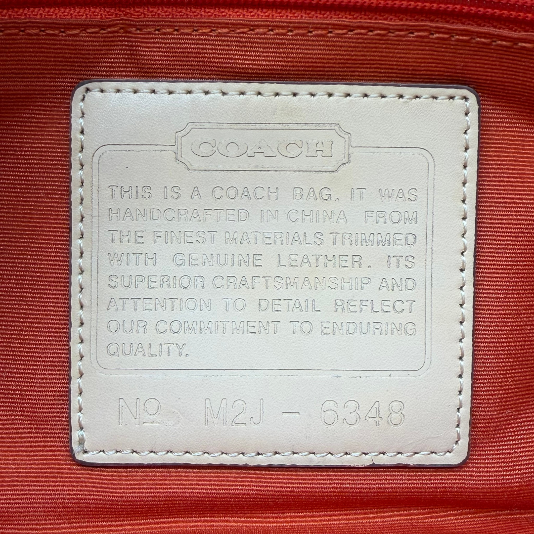 Coach Pochette Signature Soho