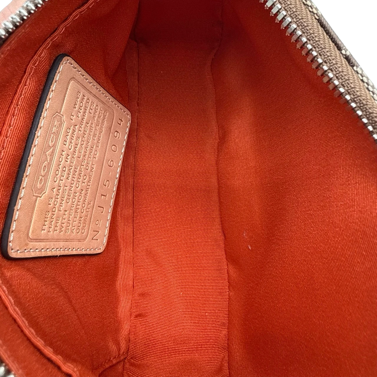 Coach Pochette Signature beige