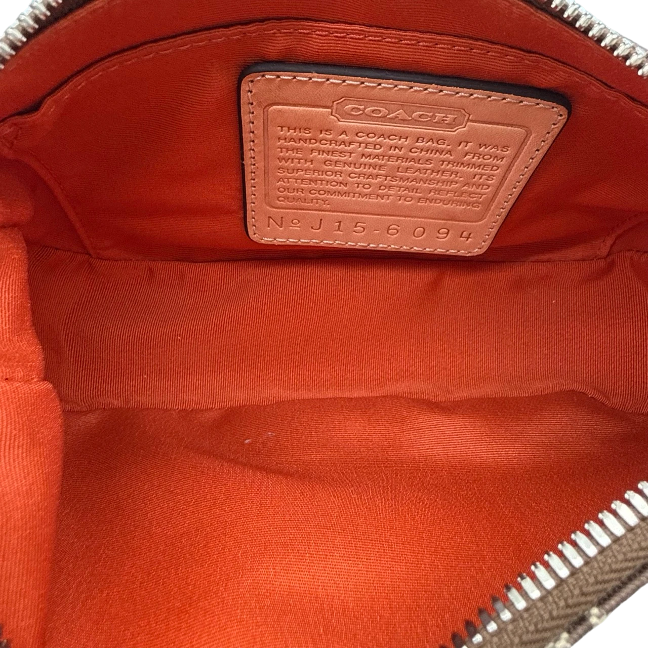 Coach Pochette Signature beige
