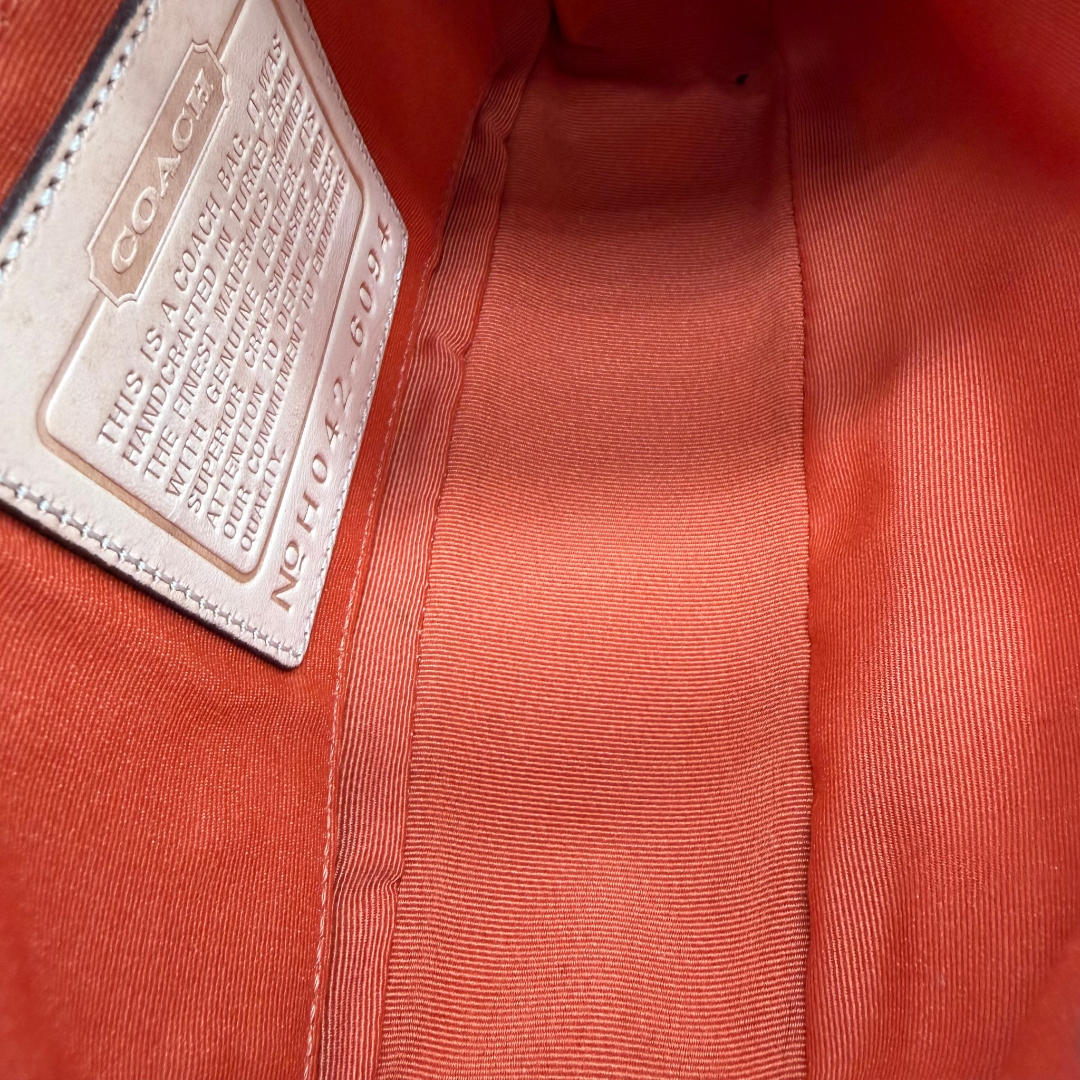 Coach Pochette Signature