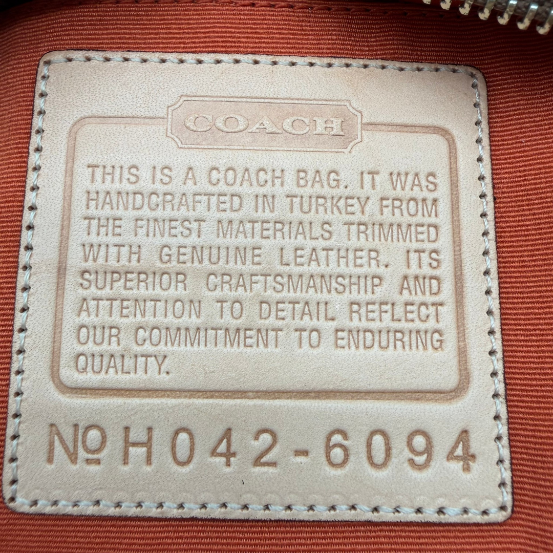 Coach Pochette Signature