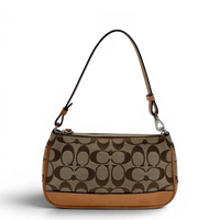 Coach Pochette Signature