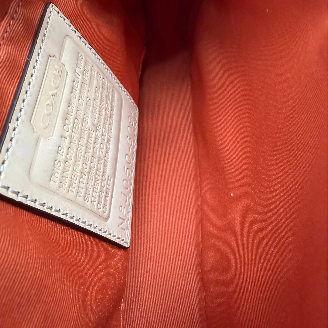 Coach Pochette Signature