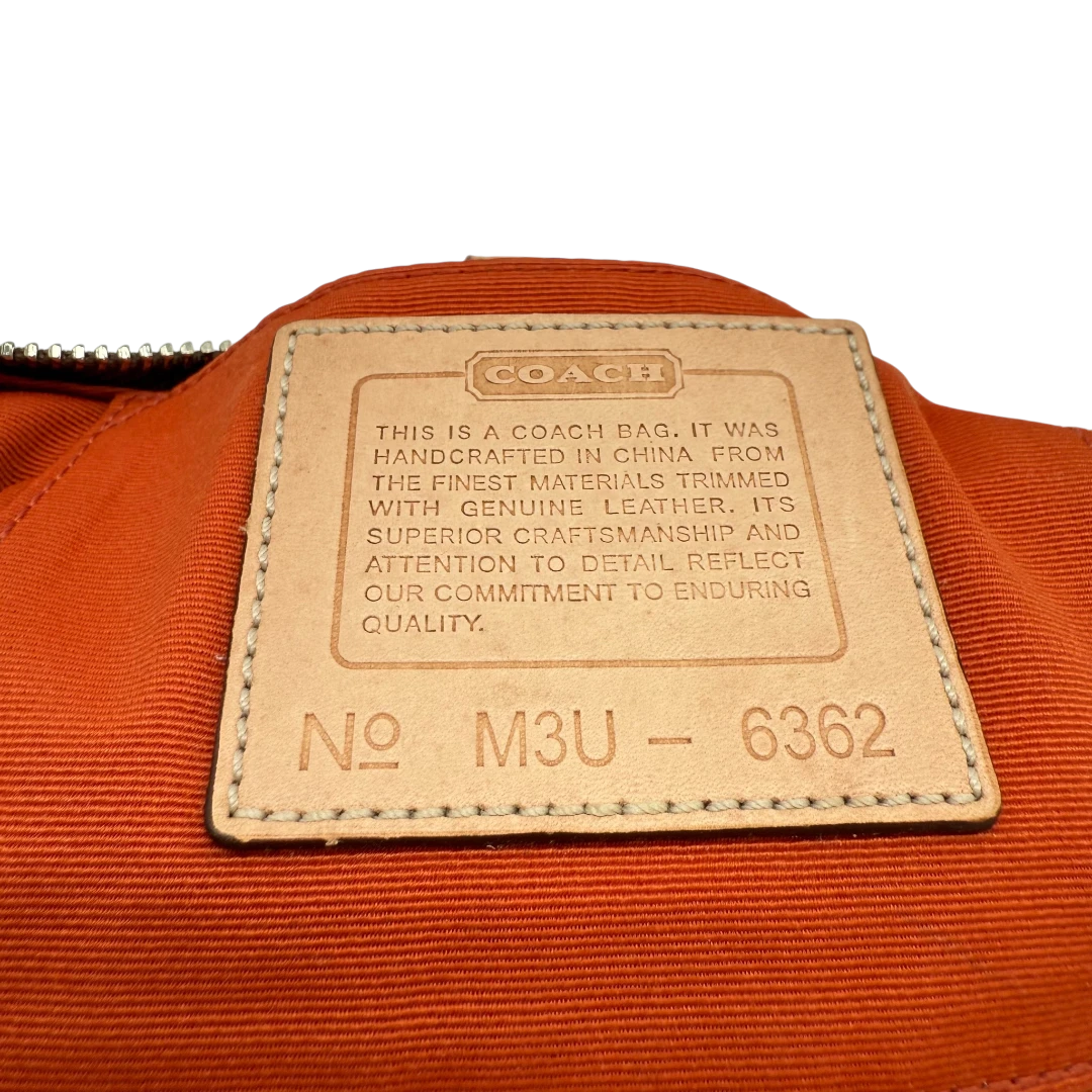 Coach Pochette Signature