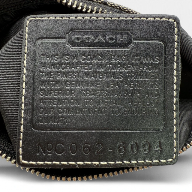 Coach Pochette black leather details monogram beige