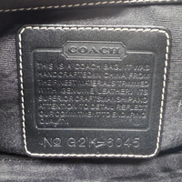 Coach Schultertasche Signature grau & schwarz – Seriennummer im Detail