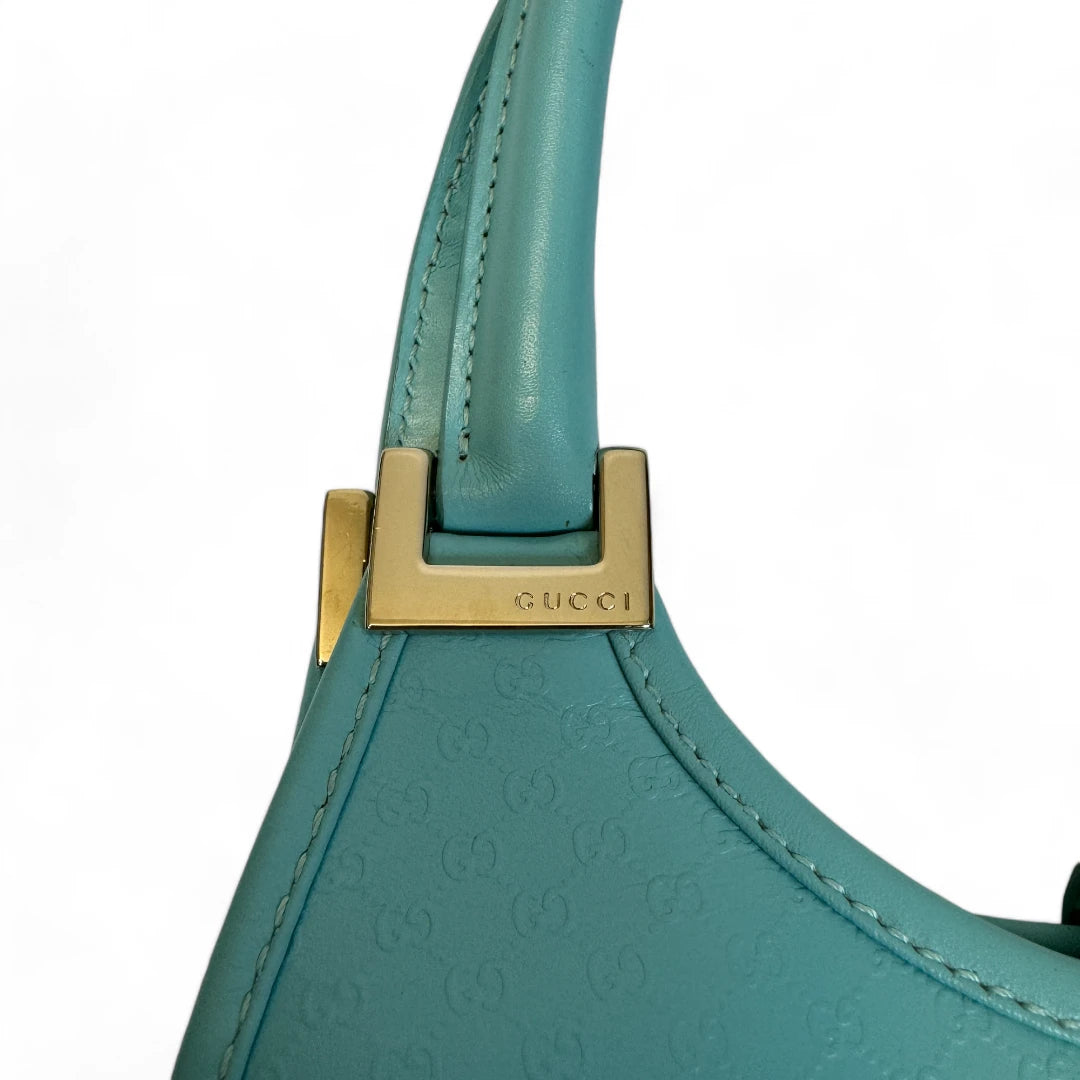 Gucci Handtasche Jackie Micro Guccissima aus Leder monogram türkis