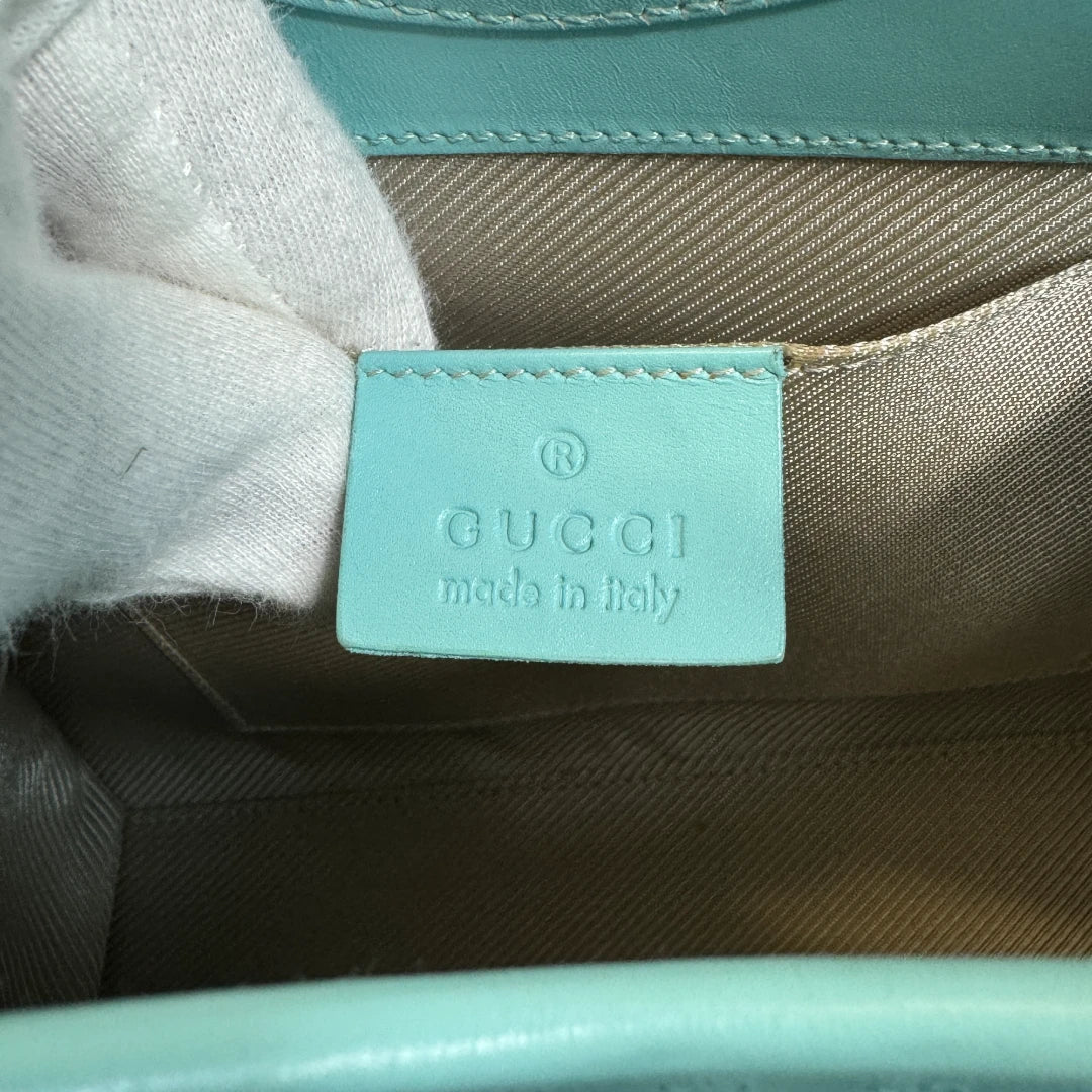 Gucci Handtasche Jackie Micro Guccissima aus Leder monogram türkis