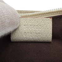 Gucci Pochette mit Charms monogram rosa – Seriennummer im Detail