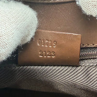 Gucci Schultertasche Jackie monogram beige – Seriennummer im Detail