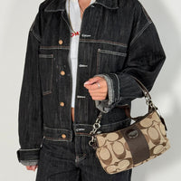 Coach Pochette Signature