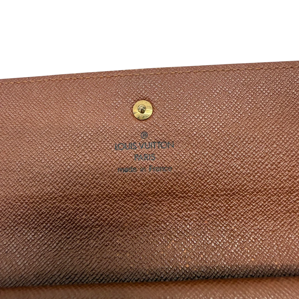Louis Vuitton Geldbeutel International monogram braun – Prägung im Detail