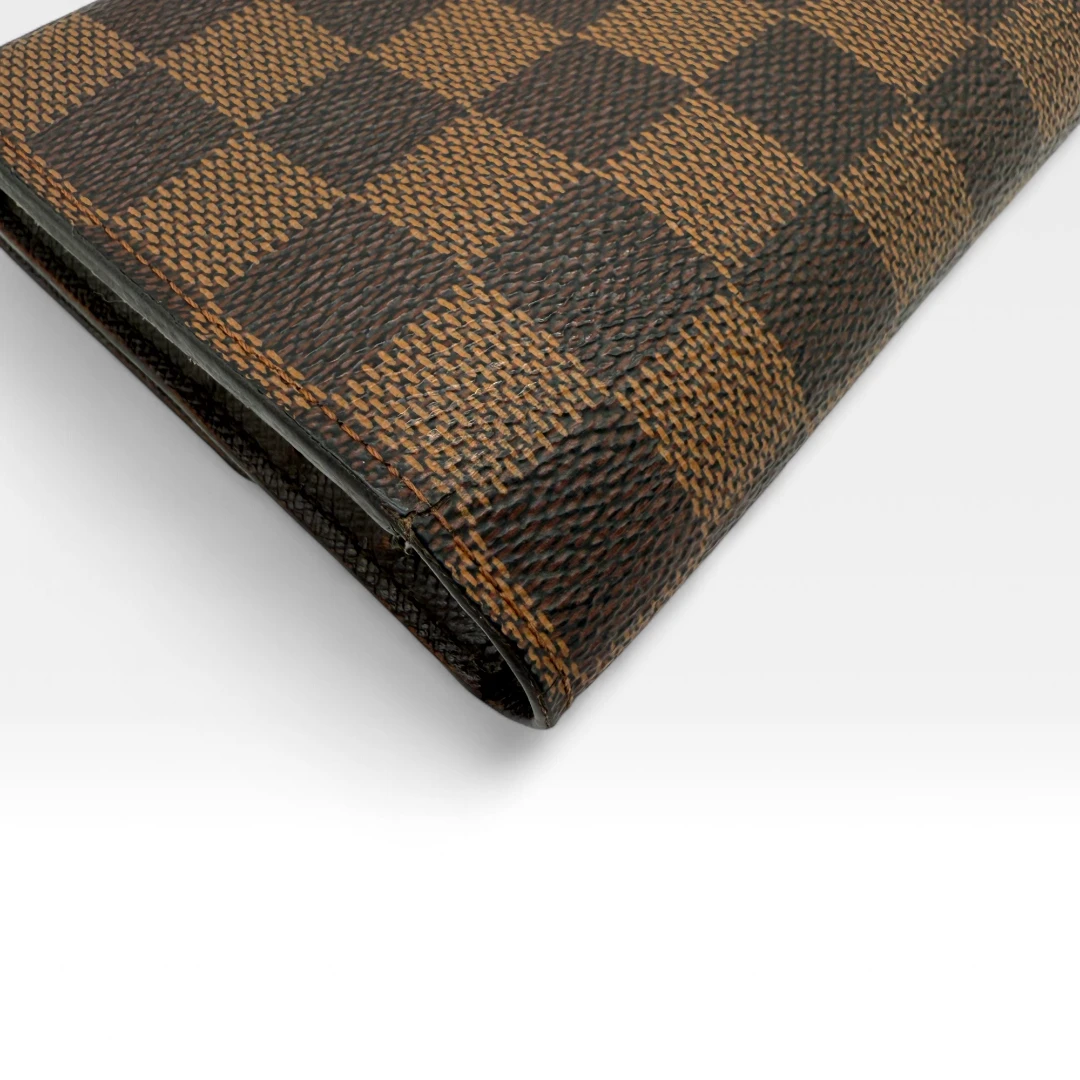 Louis Vuitton Geldbeutel Porte-Tresor International Damier Ebene braun