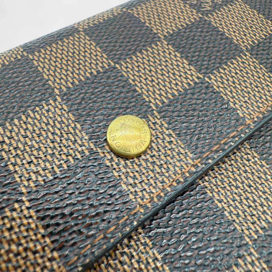 Louis Vuitton Geldbeutel Porte-Tresor International Damier Ebene braun
