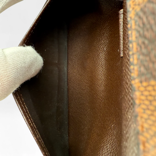 Louis Vuitton Geldbeutel Porte-Tresor International Damier Ebene braun