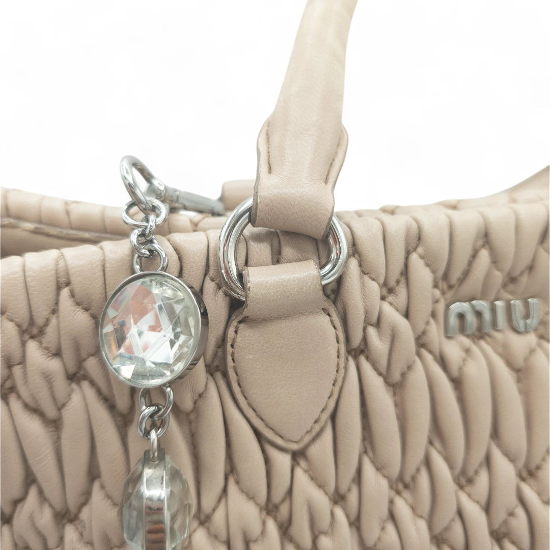 Miu Miu handbag Matelassé with shoulder strap and Miu Miu charm in pink leather