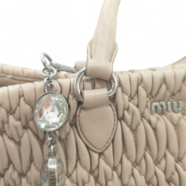 Miu Miu handbag Matelassé with shoulder strap and Miu Miu charm in pink leather