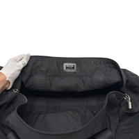 Prada Reisetasche in Zylinderform aus Nylon schwarz – Innenetikett im Detail